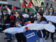 New Zealand pro-Palestine protesters in Auckland carry mock "bodies" today representing Gazan journalists killed by the Israeli military