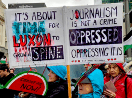 A demonstration placard last weekend against Prime Minister Christopher Luxon's weakness over Palestine and condemning Israeli oppression against Gazan journalists