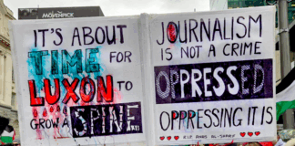 A demonstration placard last weekend against Prime Minister Christopher Luxon's weakness over Palestine and condemning Israeli oppression against Gazan journalists