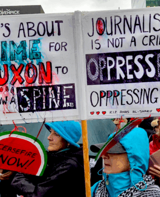 A demonstration placard last weekend against Prime Minister Christopher Luxon's weakness over Palestine and condemning Israeli oppression against Gazan journalists
