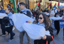 New Zealand protesters carry symbolic "bodies" of Palestinian journalists slaughtered by the Israeli military
