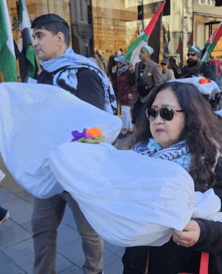 New Zealand protesters carry symbolic "bodies" of Palestinian journalists slaughtered by the Israeli military