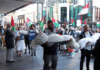 New Zealand protesters over the Israeli killings of Palestinian journalists in Gaza carry symbolic bodies