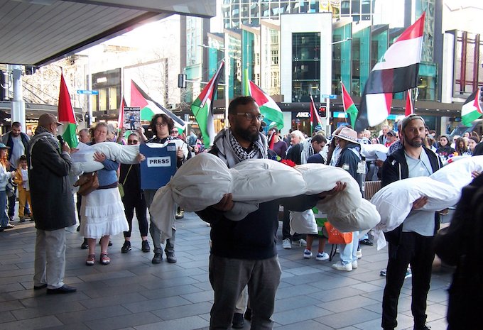 Mourning Gaza journalists BK 680wide New Zealand protesters over the Israeli killings of Palestinian journalists in Gaza carry symbolic bodies