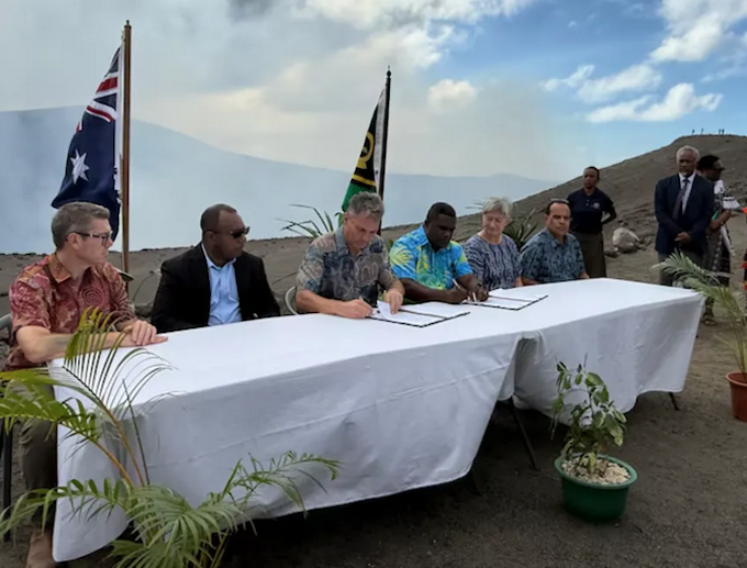 Nakamal pact RNZ 680wide Senior ministers from Australia and Vanuatu initialled the Nakamal Agreement at the top of Mount Yasur. (ABC News: Lillyrose Welwel) Photo: ABC News / Lillyrose Welwel