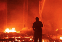 Marshall Islands firefighters try to contain the Nitijela (Parliament) fire
