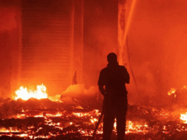 Marshall Islands firefighters try to contain the Nitijela (Parliament) fire