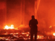 Marshall Islands firefighters try to contain the Nitijela (Parliament) fire