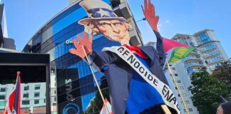 An Uncle Sam puppet with blood on his hands held aloft by pro-Palestinian protesters in Auckland, New Zealand