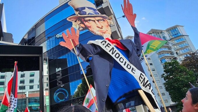An Uncle Sam puppet with blood on his hands held aloft by pro-Palestinian protesters in Auckland, New Zealand