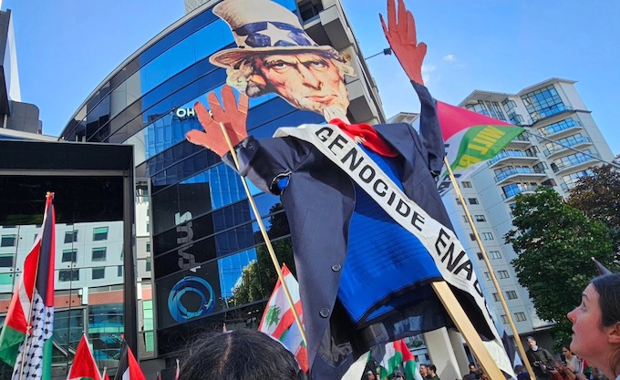 TVNZ protest Uncle Sam blood APR 680wide An Uncle Sam puppet with blood on his hands held aloft by pro-Palestinian protesters in Auckland, New Zealand