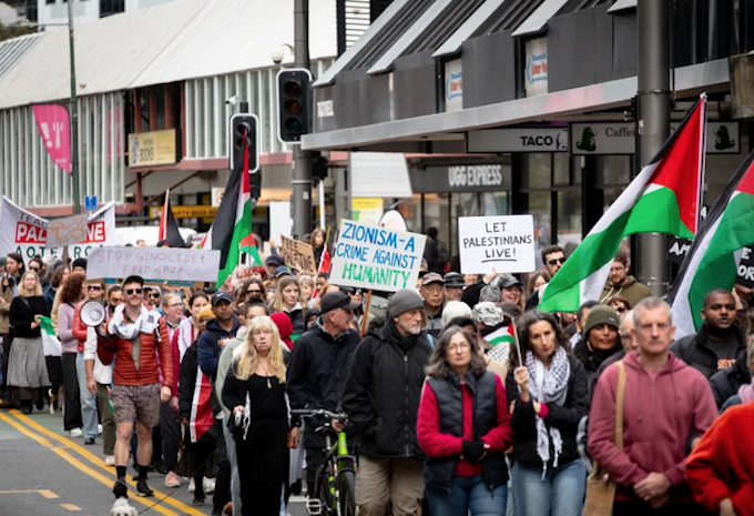 Wellington Pal protest RNZ 680wide Placards declare
