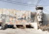 Israel's "apartheid wall" looms high above Aida refugee camp, up to nine metres tall in some places