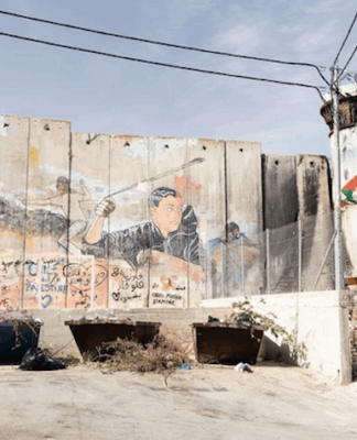 Cole Martin: The Gaza ceasefire isn’t the end – what six months in Palestine showed me Israel's "apartheid wall" looms high above Aida refugee camp, up to nine metres tall in some places