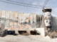 Israel's "apartheid wall" looms high above Aida refugee camp, up to nine metres tall in some places