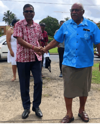 Professor Biman Prasad (left) and Prime Minister Sitiveni Rabuka in December 2022
