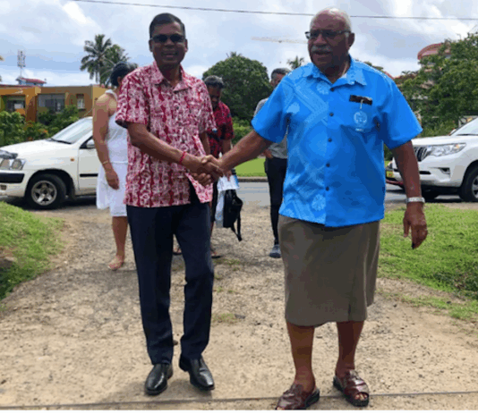 Professor Biman Prasad (left) and Prime Minister Sitiveni Rabuka in December 2022