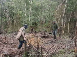 Kiwirok villagers show some of the areas that have been bombed in the attack on their village