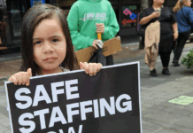 NZ health minister unethical over medical ethics – ‘look in the mirror’ A child holds a medical "safe staffing" placard at the mega strike in Auckland