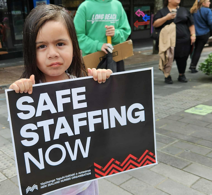 Safe staffing now APR 680wide A child holds a medical