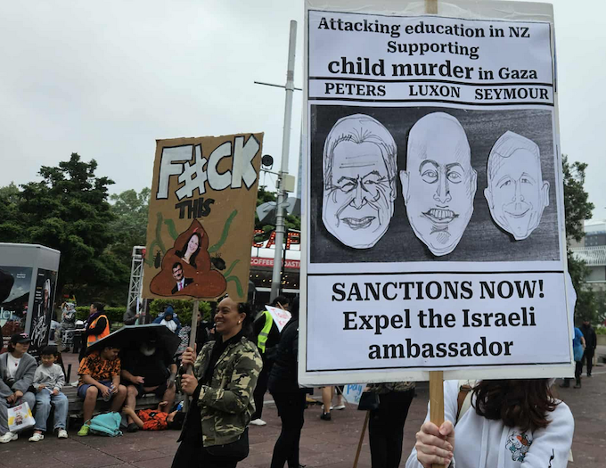 Sanctions protest APR 680wide New Zealand protesters hold a placard calling for sanctions against Israel
