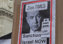 "War criminal" . . . a poster condemning Israeli Prime Minister Benjamin Netanyahu