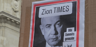 "War criminal" . . . a poster condemning Israeli Prime Minister Benjamin Netanyahu