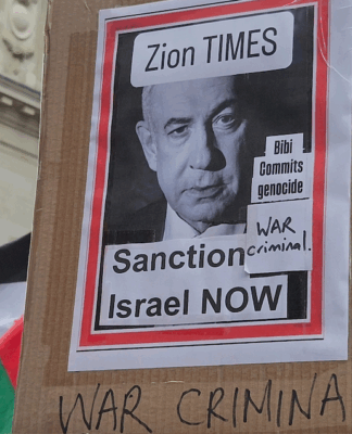 "War criminal" . . . a poster condemning Israeli Prime Minister Benjamin Netanyahu