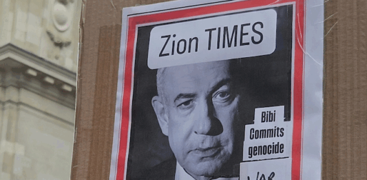 "War criminal" . . . a poster condemning Israeli Prime Minister Benjamin Netanyahu