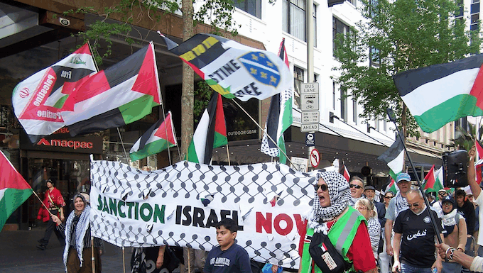 Palestinian supporters protest against the ongoing Gaza genocide by Israel in spite of the "ceasefire"