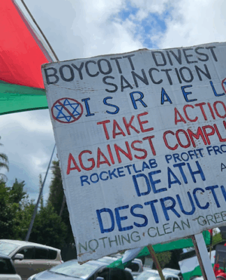 NZ Palestine protesters condemn govt over failure to impose sanctions against Israel A BDS - boycott, divestment and sanctions - placard