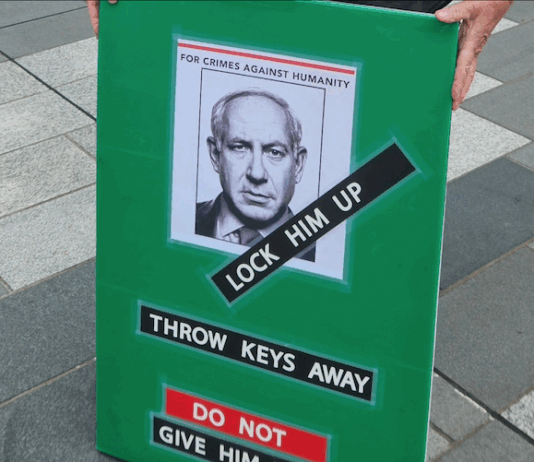 Israeli Prime Minister Benjamin Netanyahu portrayed on a placard at a New Zealand pro-Palestine rally