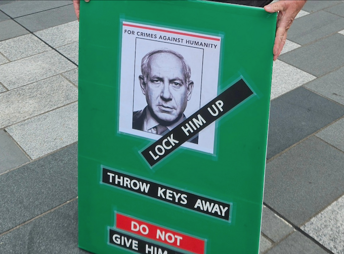 Benjamin Netanyahu APR 680wide Israeli Prime Minister Benjamin Netanyahu portrayed on a placard at a New Zealand pro-Palestine rally