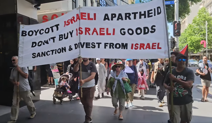 "Boycott Israel" declares a banner at today's UN Solidarity Day rally in Auckland