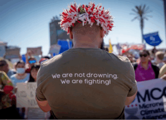 Pacific youth climate activist at a demonstration at COP27 in 2022