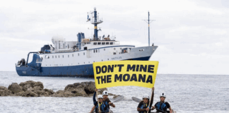 Cook Island activists peacefully confront the Nautilus at Rarotonga port last month, holding banners proclaiming "Don’t Mine The Moana"