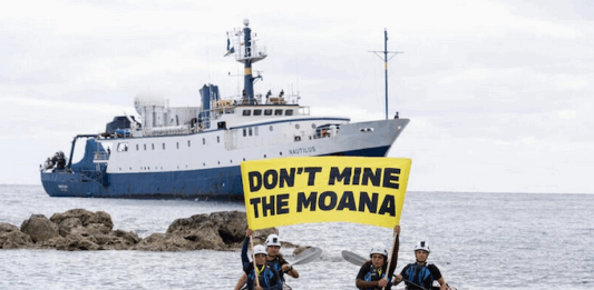 Growing local opposition to seabed mining decision has forced Cook Islands delay, says Greenpeace Cook Island activists peacefully confront the Nautilus at Rarotonga port last month, holding banners proclaiming "Don’t Mine The Moana"