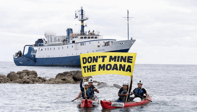 Cook Island activists peacefully confront the Nautilus at Rarotonga port last month, holding banners proclaiming "Don’t Mine The Moana"