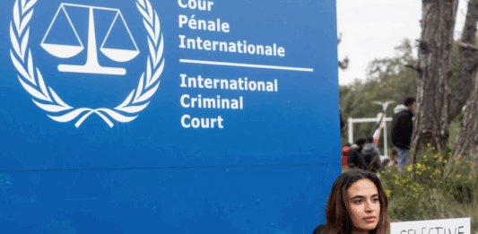 How Israel has set a dangerous precedent in international law A demonstrator holds a sign reading, "Selective Justice is Injustice"