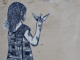 Street art depicting a girl holding a paper boat, with half of her dress showing buildings