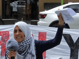 Palestinian rally MC Lamees Elthiny speaks to a protest rally in Auckland today themed on the "BDS - Boycott Divestments Sanctions" campaign against New Zealand companies alleged to be complicit with Israel's genocide in Gaza