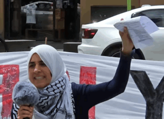 Palestinian rally MC Lamees Elthiny speaks to a protest rally in Auckland today themed on the "BDS - Boycott Divestments Sanctions" campaign against New Zealand companies alleged to be complicit with Israel's genocide in Gaza