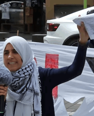 Palestinian rally MC Lamees Elthiny speaks to a protest rally in Auckland today themed on the "BDS - Boycott Divestments Sanctions" campaign against New Zealand companies alleged to be complicit with Israel's genocide in Gaza