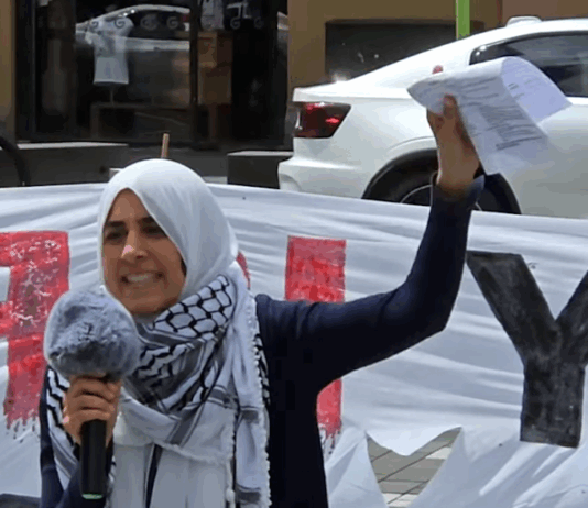 Palestinian rally MC Lamees Elthiny speaks to a protest rally in Auckland today themed on the "BDS - Boycott Divestments Sanctions" campaign against New Zealand companies alleged to be complicit with Israel's genocide in Gaza