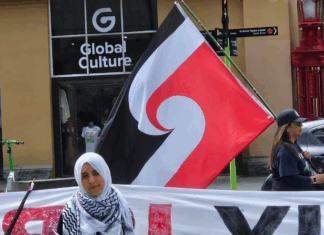 Australian author says shadow Gaza transit scheme company is operating ‘disaster capitalism’ Pro-Palestinian activist Lamees Elthiny speaking to protesters in Auckland