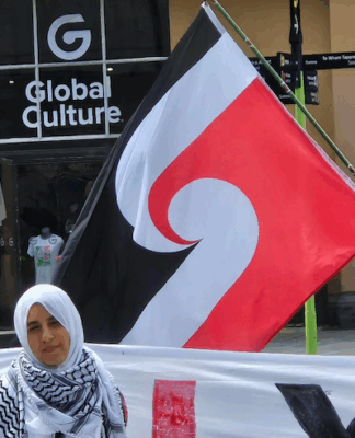 Australian author says shadow Gaza transit scheme company is operating ‘disaster capitalism’ Pro-Palestinian activist Lamees Elthiny speaking to protesters in Auckland