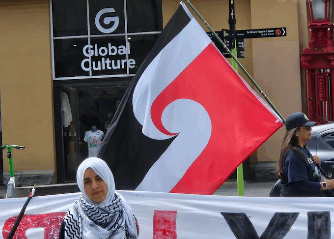 Australian author says shadow Gaza transit scheme company is operating ‘disaster capitalism’ Pro-Palestinian activist Lamees Elthiny speaking to protesters in Auckland