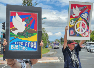 "Let Gaza Live" says a placard in a New Zealand protest against the Israeli genocide and environmental devastation in West Auckland