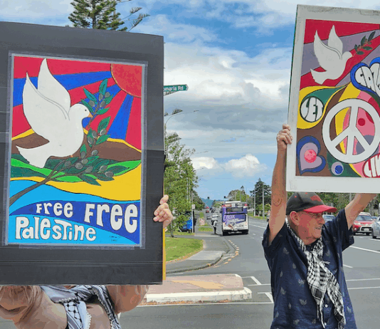 "Let Gaza Live" says a placard in a New Zealand protest against the Israeli genocide and environmental devastation in West Auckland