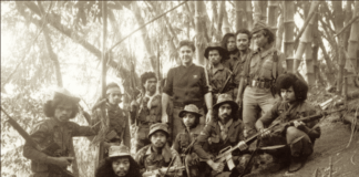 Australian journalist Roger Domm with Falintil resistance fighters in Timor-Leste in 1990